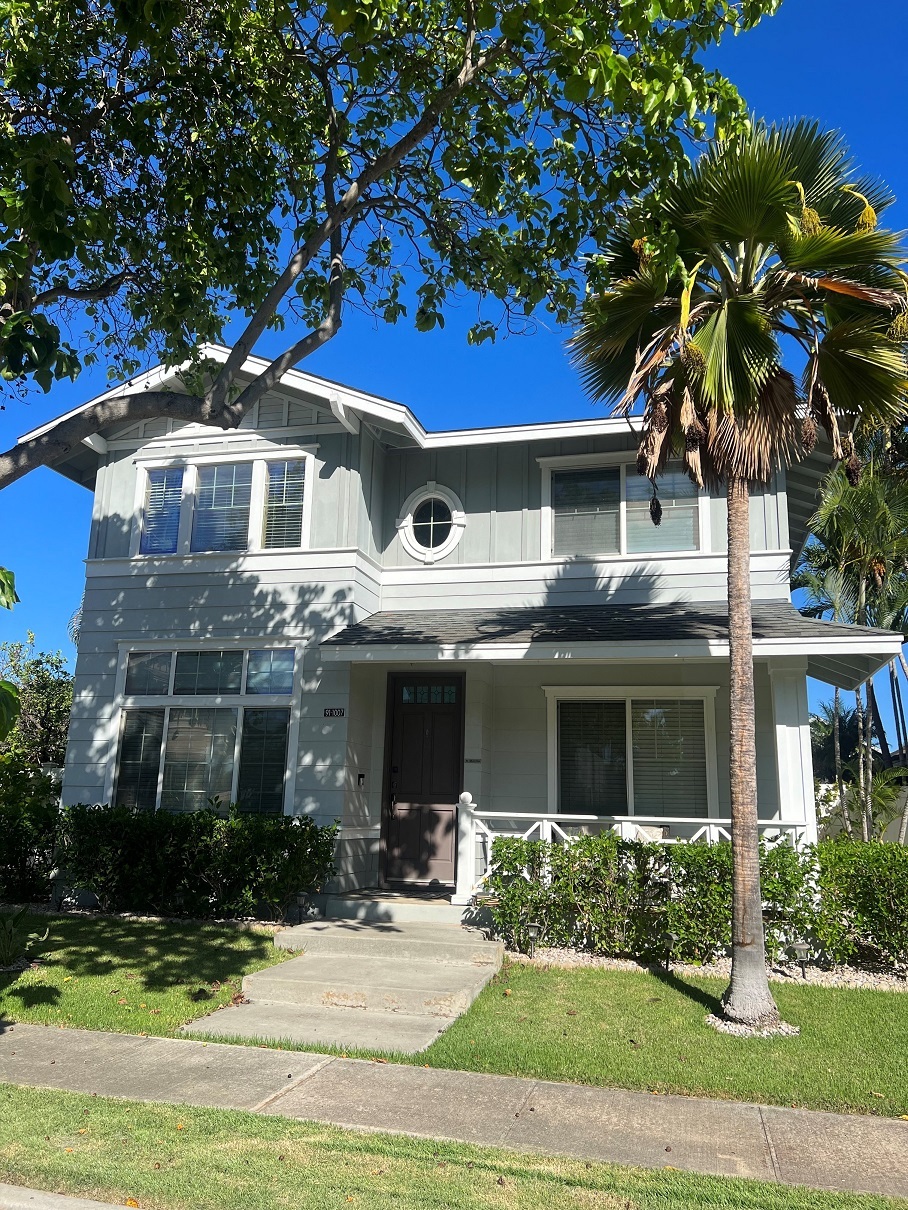 a house with a palm tree in front of it